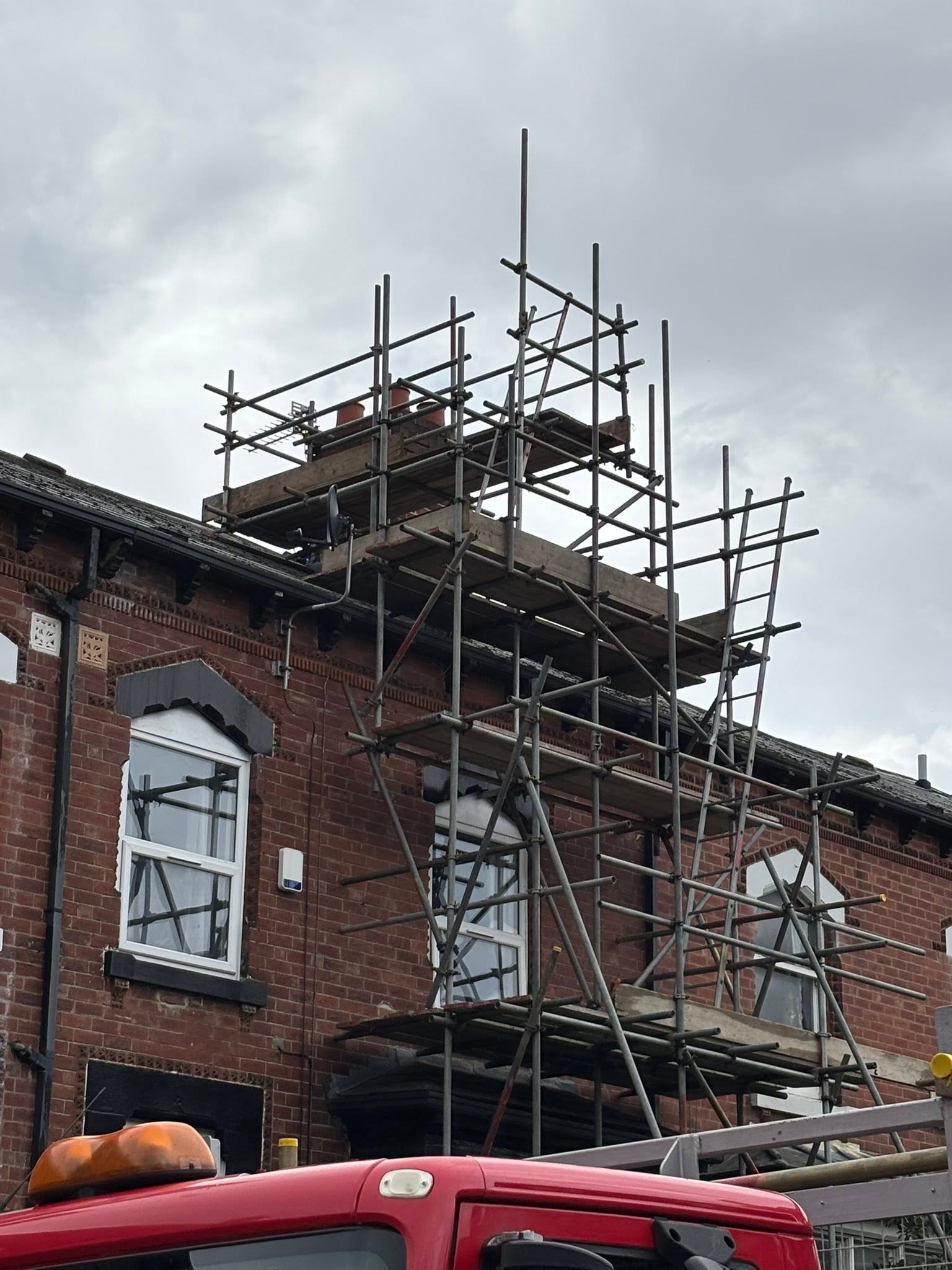 Chimney stack access scaffold erected around a chimney on a roof in Leeds