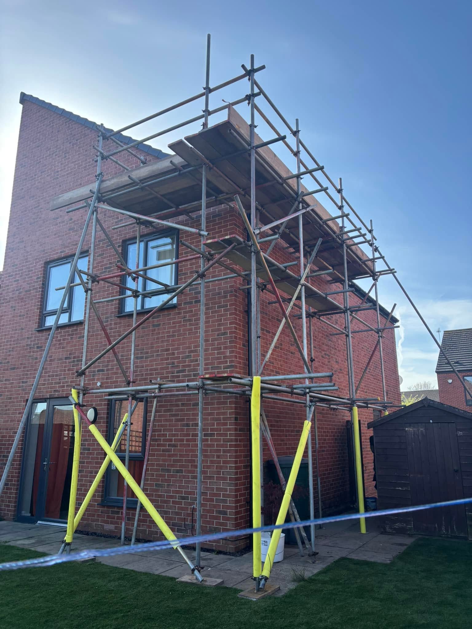 Domestic tube and fitting scaffold around a house in Pudsey, Leeds